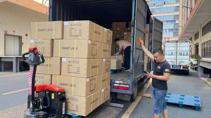 CaremLock boxed smart locks loaded into a shipping container